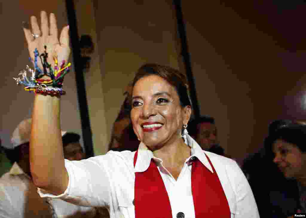 Xiomara Castro, presidential candidate of the Liberty and Refoundation Party, waves to supporters gathered at a local hotel in Tegucigalpa, Honduras, Nov. 24, 2013. 