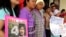 FILE - Karen activists in the northern province of Chiang Mai, hold a picture of Billy during a rally demanding authorities speed up the investigation and bring back their missing colleague Por Cha Lee Rakcharoen, known as "Billy" outside the governor's