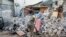 A soldier walks past rubble in the aftermath of an attack on the Afrik Hotel in Mogadishu, Somalia, Feb. 1, 2021. Al-Shabab claimed responsibility for the deadly assault. 