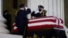 USA, Washington, A Supreme Court Honor Guard moves the flag-draped casket of Justice Ruth Bader Ginsburg