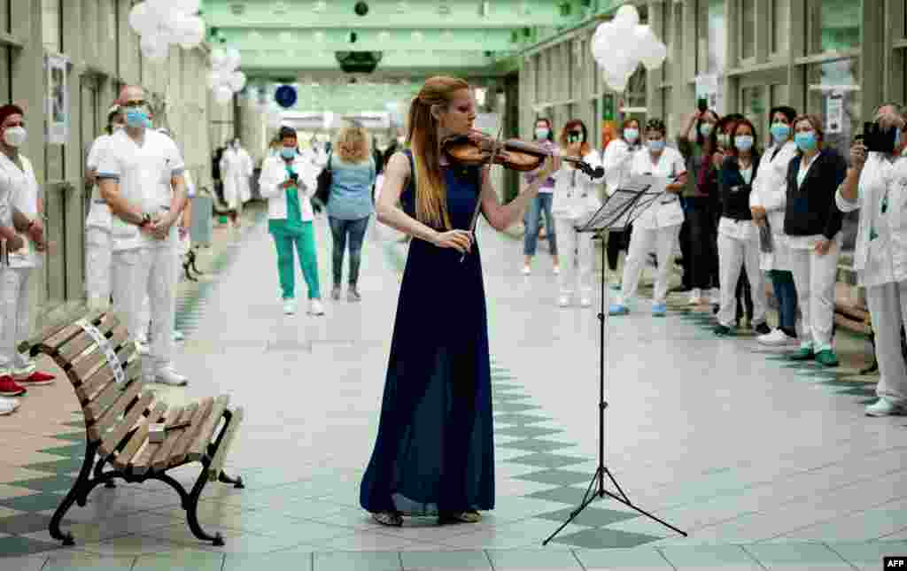 Italian violinist Fiamma Flavia Paolucci performs at Tor Vergata Hospital in Rome, as the world is marking International Nurses Day, during the country&#39;s partial lockdown aimed at curbing the spread of the COVID-19.