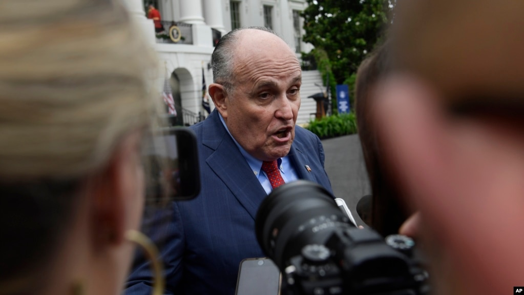 FILE - President Donald Trump's lawyer Rudy Giuliani speaks to reporters on the South Lawn of the White House in Washington, May 30, 2018.