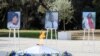 The portraits of, from left, victims Nadine Devillers, Vincent Loques and Brazil's Simone Barreto Silva are pictured during a ceremony in Nice, France, November 7, 2020.