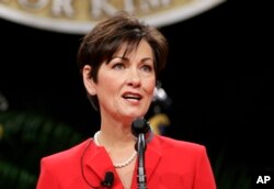 FILE - In this Jan. 16, 2015, photo, Iowa Lt. Gov. Kim Reynolds delivers remarks after taking the oath of office during inauguration ceremonies in Des Moines.