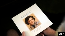 FILE - A guest holds the funeral program before the funeral service for former first lady Rosalynn Carter at Maranatha Baptist Church, in Plains, Georgia, on November 29, 2023.