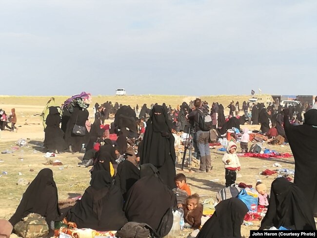 In the final weeks IS held a camp near Baghuz, Syria thousands of people evacuated the area, far more than any militaries or aid groups expected, pictured near Baghuz on March 10, 2019.