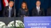 President Donald Trump, left and first lady Melania Trump, center, and Pennsylvania Governor Tom Wolf, listen as the names of the 44 people who died in the crash of Flight 93 are read during the September 11th Flight 93 Memorial Service in Shanksville, Pa