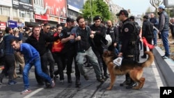 Police arrest demonstrators as they march during May Day, in Istanbul, May 1, 2017.