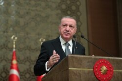 Turkish President Recep Tayyip Erdogan speaks during a symposium in Ankara, Turkey, Jan. 2, 2020.