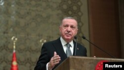 Turkish President Recep Tayyip Erdogan declares the start of a military deployment to Libya, Jan. 6, 2020. Erdogan said Turkish forces would do their duty in Libya after being deployed to support the country's besieged Government of National Accord. 