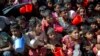 Rohingya Muslim children, who crossed over from Myanmar into Bangladesh, wait squashed against each other to receive food handouts distributed to children and women by a Turkish aid agency at the Thaingkhali refugee camp in Ukhiya, Bangladesh, Nov. 14, 20