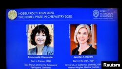 Pictures of Emmanuelle Charpentier and Jennifer A. Doudna, winners of the 2020 Nobel Prize in Chemistry, are displayed on a screen during the news conference announcing the laureates, at the Royal Swedish Academy of Sciences, in Stockholm, Sweden.