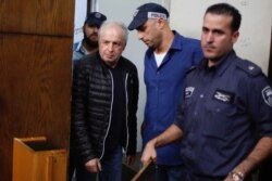 FILE - Bezeq telecom company's controlling shareholder Shaul Elovitch arrives to the magistrate court in Tel Aviv, Israel, Feb. 22, 2018.