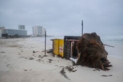 A lifeguard tower lays on its side after it was toppled over by Hurricane Delta in Cancun, Mexico, Oct. 7, 2020.