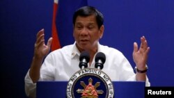 Philippines President Rodrigo Duterte speaks with the Filipino community during his official visit in Kuala Lumpur, Malaysia November 9, 2016.