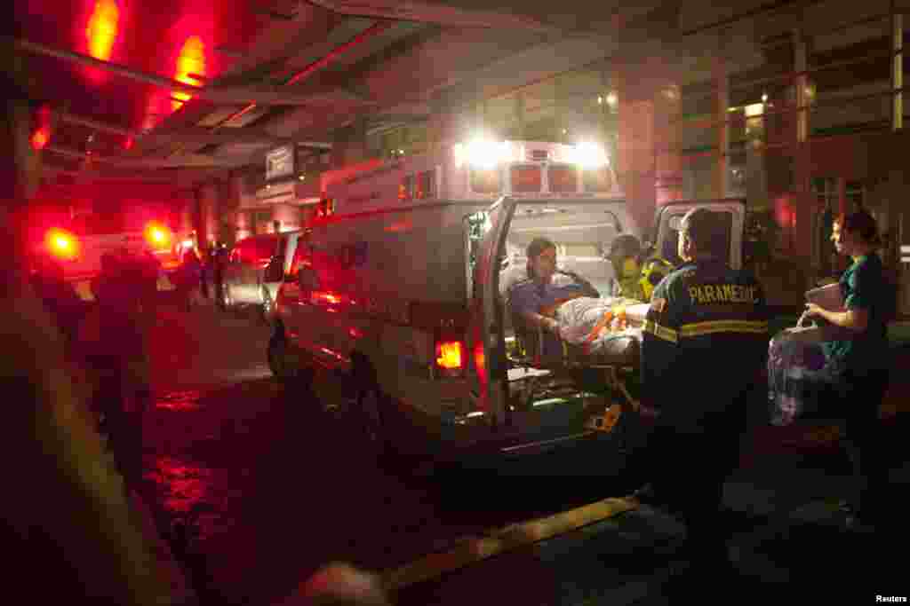 Paramedics evacuate patients from New York University Tisch Hospital due to a power outage as Hurricane Sandy makes its approach in New York October 29, 2012. More than 5.5 million people were left without electrical power by the storm, which crashed asho