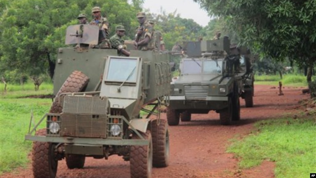 Ugandan troops patrol town of Zemio in Central African Republic, where they are hunting down fugitive members of the Lord's Resistance Army, June 25, 2014.