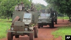 Ugandan troops patrol town of Zemio in Central African Republic, where they are hunting down fugitive members of the Lord's Resistance Army, June 25, 2014.