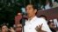 FILE - Indonesian president-elect Joko Widodo gestures as he speaks to his supporters during a gathering in Jakarta.