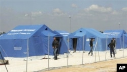 Migrants arrive at a detention center in Manduria in southern Italy, March 27, 2011. The center was established to help the many African migrants and refugees who fled North African countries.