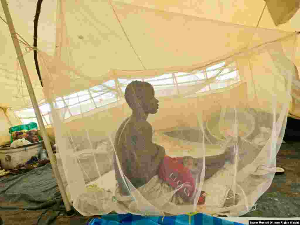 Nyanial, 22, nurses one of her children at the UNMISS camp in Bentiu in June. Nyanial fled to the camp after her village in Koch county was attacked by government soldiers and allied militia fighters in May. &quot;We thought that women and children would be safe but we were &nbsp;wrong.&quot;