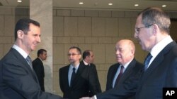 Beşar Esad ve Rusya Dışişleri Bakanı Sergei Lavrov (arşiv)