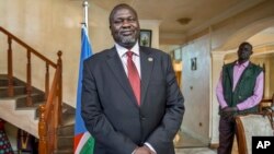 FILE - South Sudan's rebel leader Riek Machar poses for a photograph as he is interviewed by The Associated Press about the situation in South Sudan.