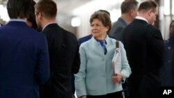 FILE - Sen. Jeanne Shaheen, D-N.H., arrives for a briefing on Capitol Hill in Washington, March, 12, 2020, on the coronavirus outbreak. 