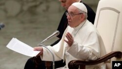 Pope Francis talks during the weekly general audience in the Paul VI Hall at the Vatican, March 7, 2018. 