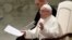 Pope Francis talks during the weekly general audience in the Paul VI Hall at the Vatican, March 7, 2018. 