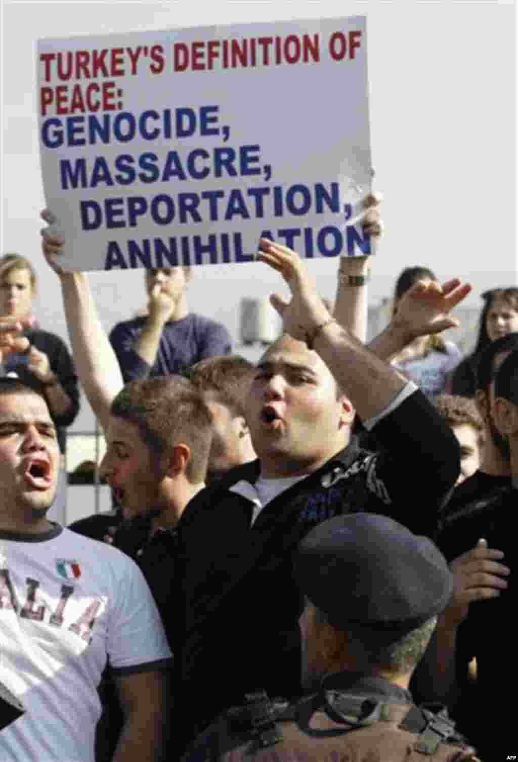 Lebanese of Armenian descent shout slogans during a protest against the visit of Turkish Prime Minister Recep Tayyip Erdogan, outside Beirut International Airport, Lebanon, Wednesday, Nov. 24, 2010. (AP Photo/Bilal Hussein)