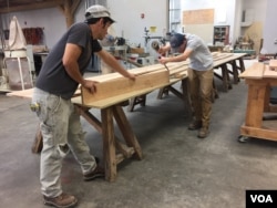 Students work on a woodworking project in a Timber Framing class at the American College of the Building Arts, Charleston, S.C., Sept. 17, 2019. (J. Taboh/VOA News)