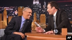 President Barack Obama, left, shares a laugh with host Jimmy Fallon on the set of the "The Tonight Show Starring Jimmy Fallon," at NBC Studios in New York, June 8, 2016.