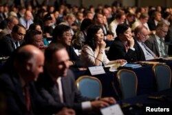 People attend a meeting of the International Air Transport Association (IATA) in Cancun, Mexico, June 5, 2017.