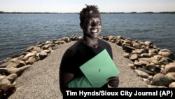 Cham Deng, a graduate of Storm Lake High, is shown in Chautauqua Park in Storm Lake, Iowa, May 15, 2019. Deng, born in the Minneapolis area to immigrants from Sudan, graduated May 19, 2019.