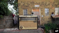 An old radio is placed outside Ngwiza Khumbulani Moyo's home in Bulawayo on February 15, 2023. (AP Photo/Tsvangirayi Mukwazhi)