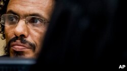 FILE - Ahmad Al Faqi Al Mahdi waits in the court room for his initial appearance at the International Criminal Court in The Hague, Netherlands, Sept. 30, 2015. 