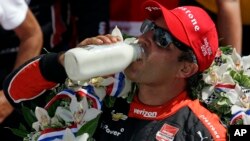 Juan Pablo Montoya, of Colombia, celebrates after winning the 99th running of the Indianapolis 500 auto race at Indianapolis Motor Speedway in Indianapolis, Sunday, May 24, 2015.