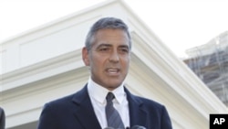 Actor George Clooney speaks to reporters after meeting with President Barack Obama about his recent trip to Sudan at the White House in Washington, Tuesday, Oct. 12, 2010. (AP Photo/Charles Dharapak)