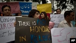 Members of Pakistan's civil society condemn the killing of pregnant woman Farzana Parveen, who was stoned to death in Islamabad, May 29, 2014.