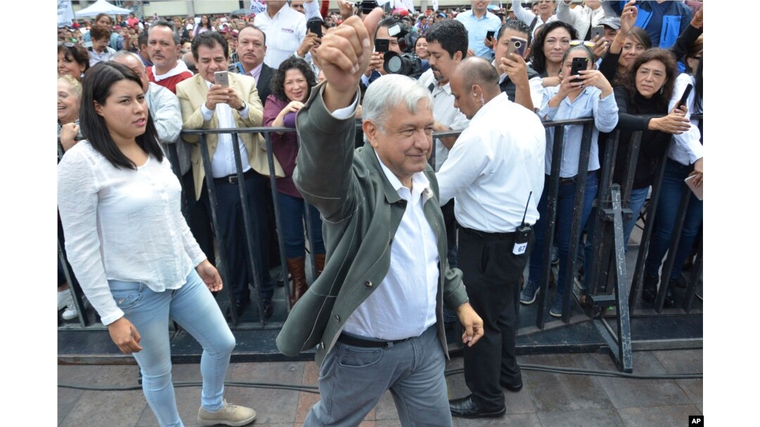 Mexico's President-elect Andres Manuel Lopez Obrador arrives to a rally commemorating the 50th anniversary of a bloody reprisal against students, at the Tlatelolco Plaza in Mexico City, Saturday, Sept. 29, 2018. Lopez Obrador vowed Saturday to never use military force against civilians. Troops fired on a peaceful demonstration at the plaza on Oct. 2, 1968, killing as many as 300 people at a time when leftist student movements were taking root throughout Latin America.