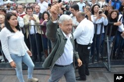 Mexico's President-elect Andres Manuel Lopez Obrador arrives to a rally commemorating the 50th anniversary of a bloody reprisal against students, at the Tlatelolco Plaza in Mexico City, Saturday, Sept. 29, 2018. Lopez Obrador vowed Saturday to never use military force against civilians. Troops fired on a peaceful demonstration at the plaza on Oct. 2, 1968, killing as many as 300 people at a time when leftist student movements were taking root throughout Latin America.