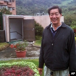 Chientan borough chief Bi Wu-liang stands on a roof of a former kindergarten set to be razed and now supporting a garden watered by captured rain.