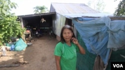 Oam Samath, 65, says she can't afford to connect her house to the electricity grid, Siem Reap, Cambodia, August 8, 2017. (Sun Narin/VOA Khmer)