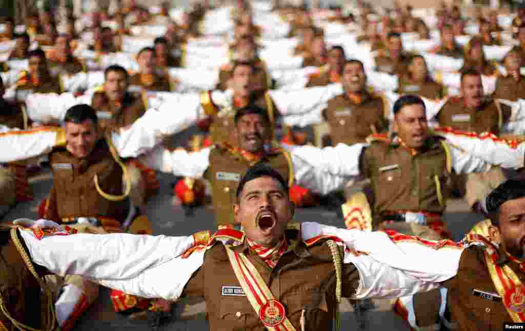 Indian soldiers take part in a laughter yoga session during their rehearsal for the Republic Day parade on a winter morning in New Delhi, India.