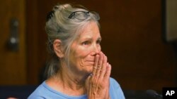 Leslie Van Houten reacts after hearing she is eligible for parole during a hearing on Sept. 6, 2017 at the California Institution for Women in Corona, Calif. 