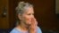 Leslie Van Houten reacts after hearing she is eligible for parole during a hearing on Sept. 6, 2017 at the California Institution for Women in Corona, Calif. 