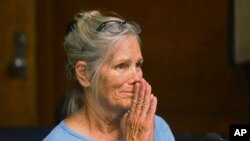 Leslie Van Houten reacts after hearing she is eligible for parole during a hearing on Sept. 6, 2017 at the California Institution for Women in Corona, Calif. 