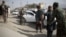 FILE - Afghan National Security Forces search passengers and vehicles at a checkpoint in Kabul, Afghanistan, Oct. 26, 2018.