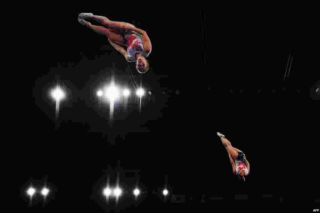 Samantha Smith (L) and Rachel Tam (R) of Canada compete during the World Trampoline Gymnastics Championships at the Ariake Gymnastics Centre in Tokyo, Japan.